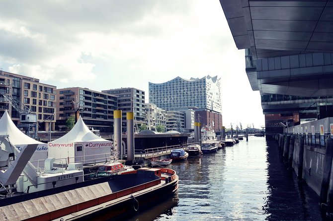 Speicherstadt and HafenCity Tour of Hamburg with German speaking guide - Speicherstadt warehouses: trade goods, canal logic, and what made it grow